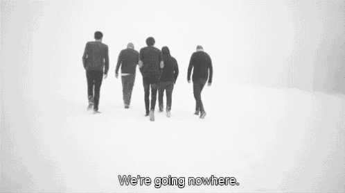 a group of people are walking in the snow with a quote that says `` we 're going nowhere . ''
