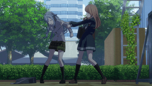 a girl with long hair is holding another girl 's arm