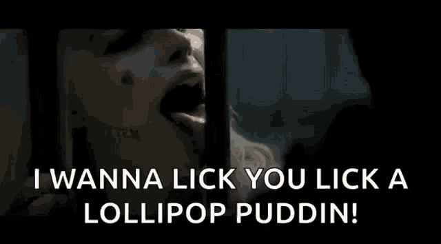 a woman is sticking her tongue out while licking a lollipop .