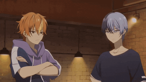 two anime characters are standing next to each other