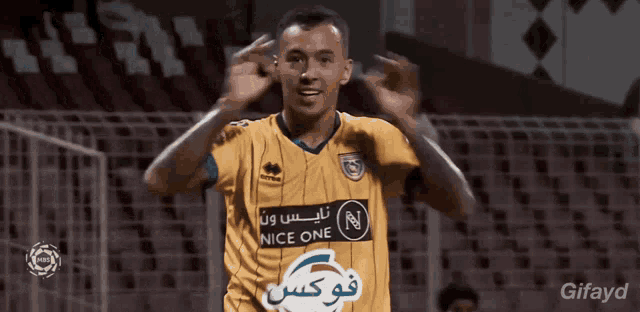 a soccer player wearing a jersey that says nice one on it