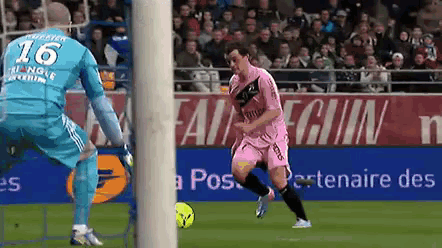 a soccer player wearing a number 16 jersey kicks the ball