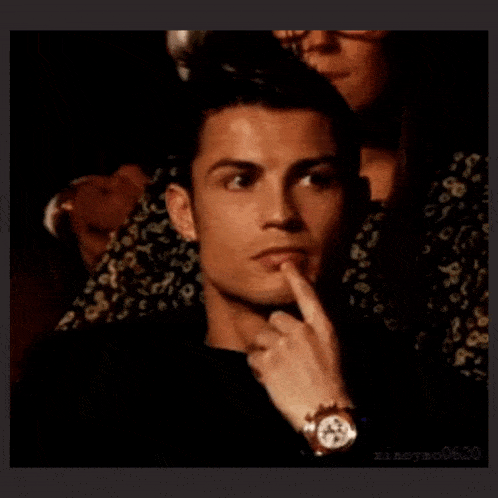 a man with a watch on his wrist is thinking