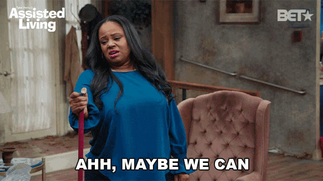 a woman holding a mop and saying ahh maybe we can