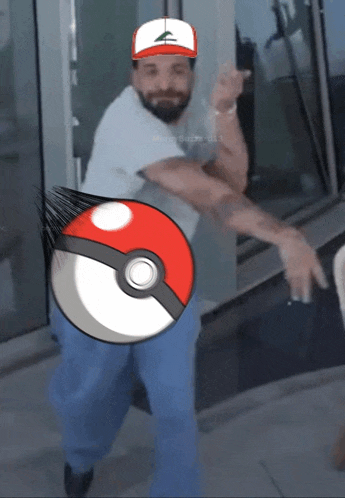 a man wearing a hat with the letter a on it is holding a pokemon ball