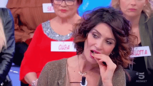 a woman with a name tag that says " olga " on it