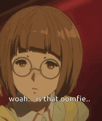 a girl with glasses is sitting in a chair and says woah is that oomfie .