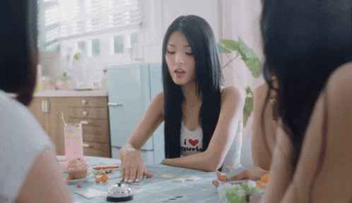 a woman wearing a tank top that says i love girls