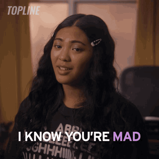 a woman says " i know you 're mad " in purple