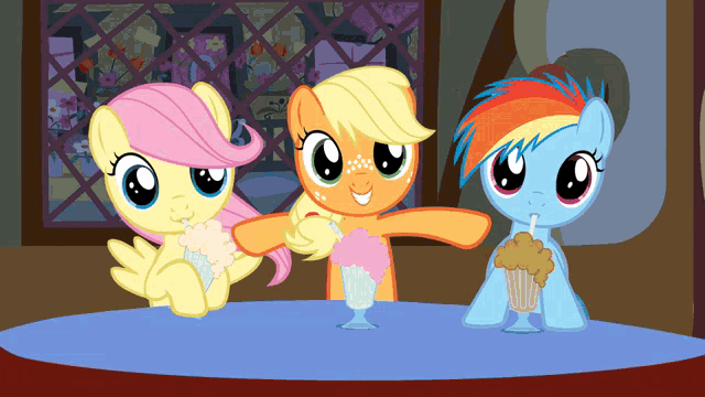 three ponies are sitting at a table with milkshakes in their mouths