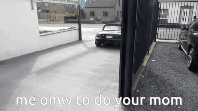 a car is parked in a parking lot with the words me omw to do your mom