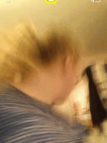 a blurry picture of a person with a snapchat icon