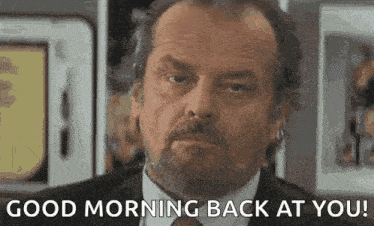 a man in a suit and tie is saying `` good morning back at you ! ''