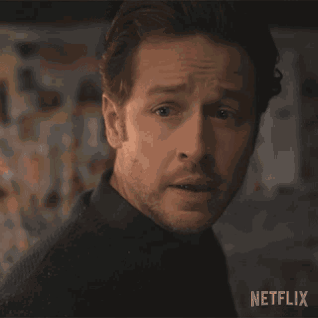 a close up of a man 's face with the word netflix on the bottom