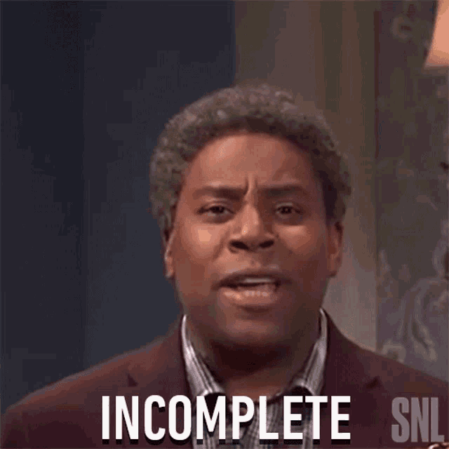 a man in a suit is making a funny face and says incomplete .