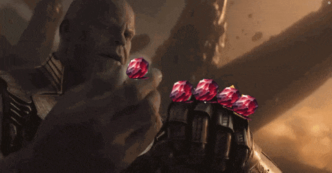 thanos from avengers infinity war is holding a bunch of gems .