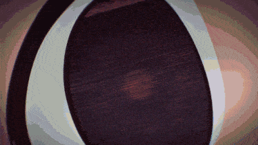 a close up of a wooden object with a white border