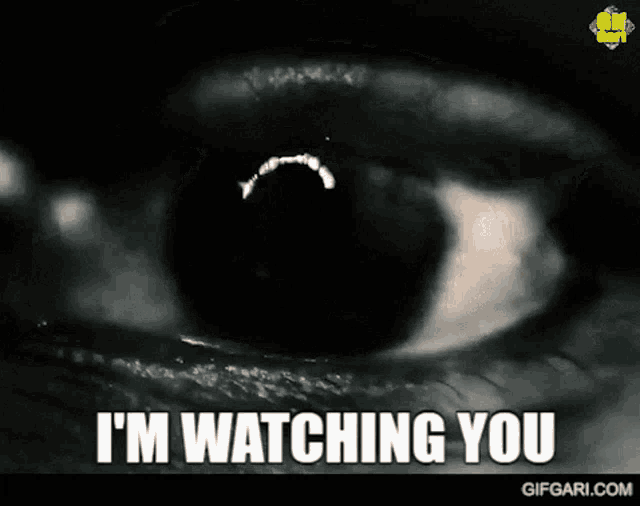 a close up of a person 's eye with the words i 'm watching you