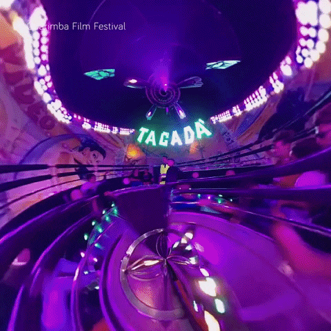 a roller coaster ride with a sign that says tacada on it