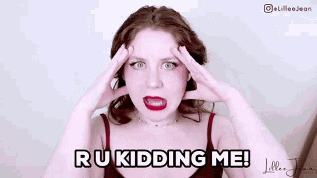 a woman is making a funny face and says ru kidding me !