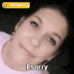 a woman in a pink shirt says i sorry on her face