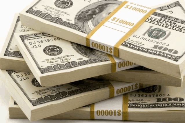 four stacks of 100 dollar bills are stacked on top of one another