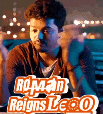 a man sitting in front of a sign that says ' reigns leo '