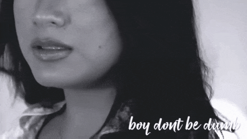 a close up of a woman 's face with the words boy dont be dumb written below her