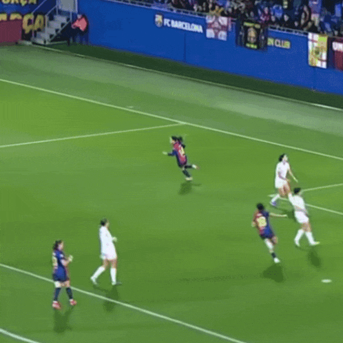 a soccer field with a banner that says fcbarcelona.cat/entradas/basquet