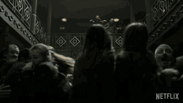 a netflix ad shows a group of people hugging in a dark room