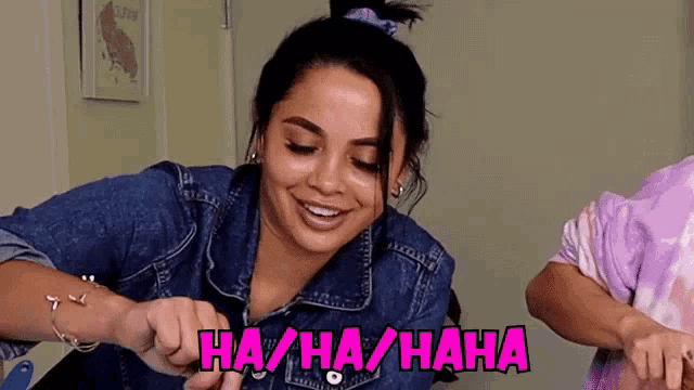 a woman is laughing with the words ha / ha / haha written above her