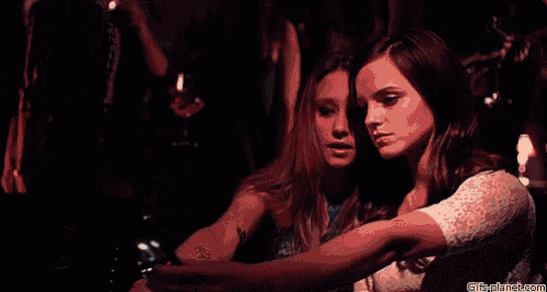 two women are taking a selfie with their cell phones .