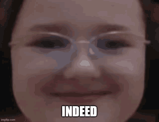 a close up of a woman 's face with glasses and the words `` indeed '' written on it .