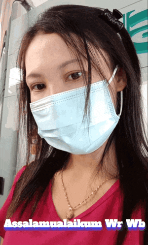 a woman wearing a face mask says assalamualaikum wrwb