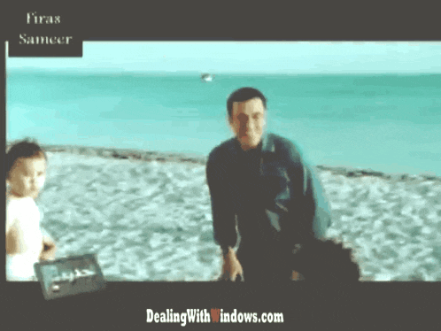 a picture of a man and a child on a beach with the website dealingwith windows.com