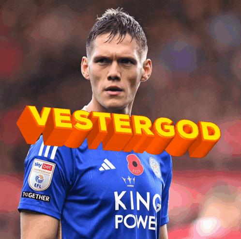 a soccer player in a blue king power shirt