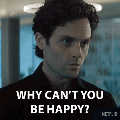 a man in a black shirt says why can t you be happy