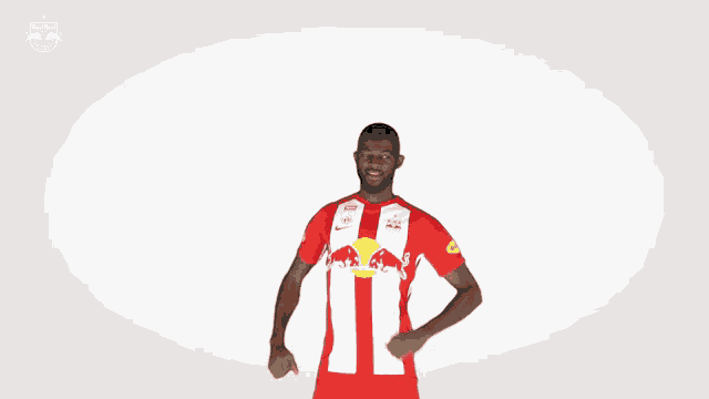 a man wearing a red and white red bulls jersey