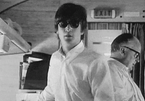 The Beatles John Lennon GIF - The Beatles John Lennon Walk With Black Shades GIFs