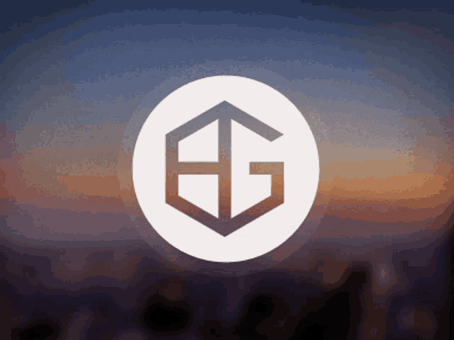 a logo with the letter g in a circle on a blurry background