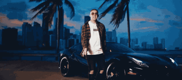 a man wearing sunglasses and a shirt that says sup on it