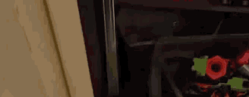 a trash can filled with toys is sitting in a closet .