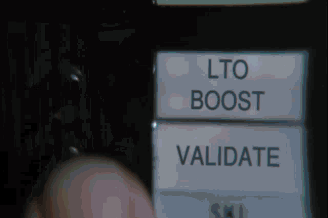 a person is pressing a button that says ' lto boost ' on it