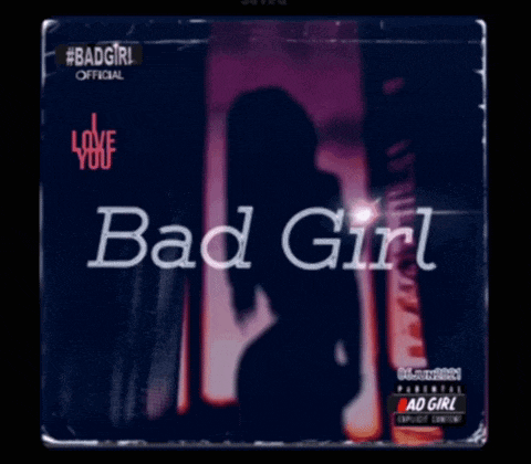a bad girl album cover shows a woman standing in front of a door