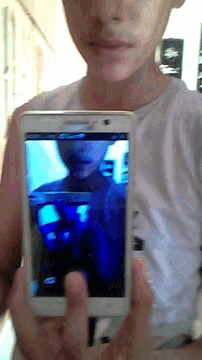 a person is taking a picture with an lg cell phone