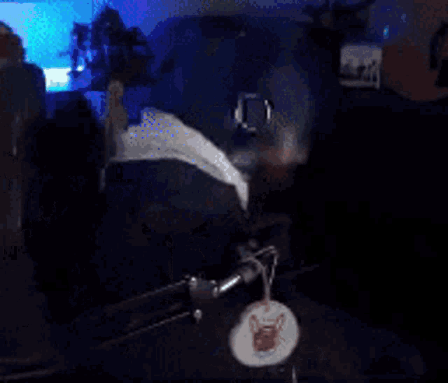 a man with a beard and glasses is wearing headphones and a hat