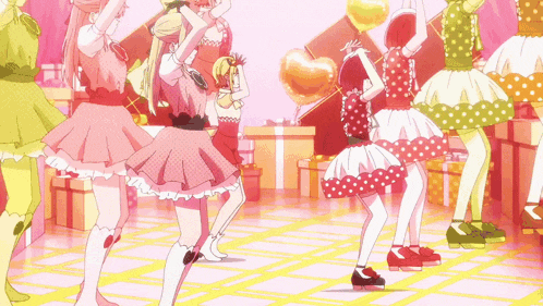 a group of girls in polka dot dresses are dancing