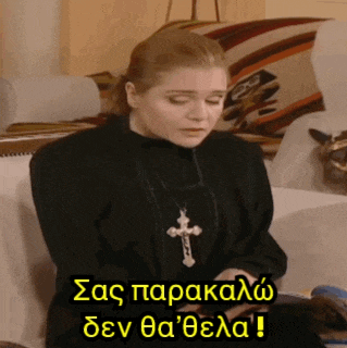 a woman with a cross necklace is sitting on a couch with a caption in a foreign language