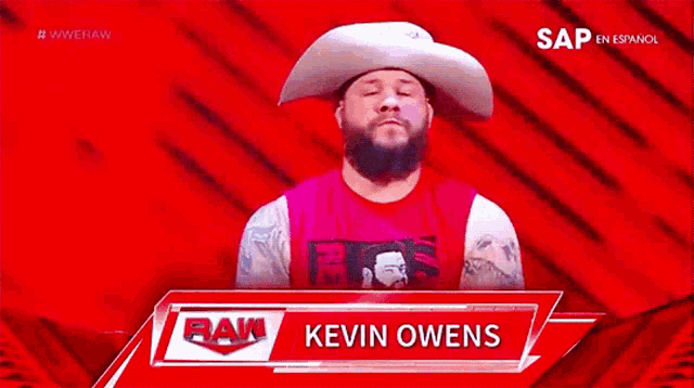 a man with a beard wearing a cowboy hat with the name kevin owens on the bottom