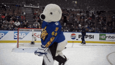 a mascot wearing a blue jersey with the number 60